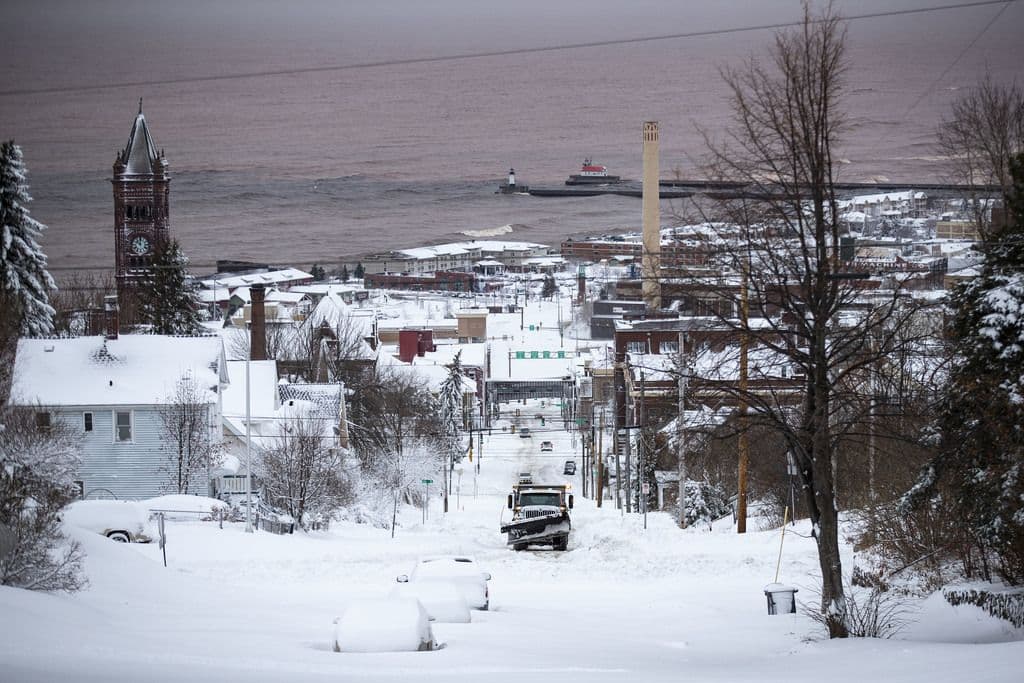 Snowy winter commute scene in Duluth, Minnesota along Lake Superior