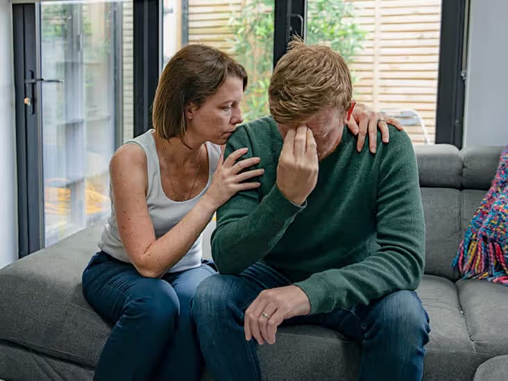 Adult reflecting on emotional needs in a supportive setting.avif
