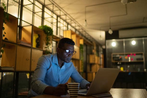 Small business owner working late in a Stillwater shop