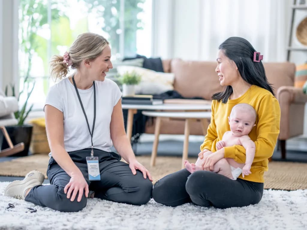 Supportive postpartum mental health conversation for a new parent.webp