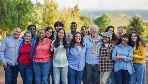 Warm group photograph of family or community members supporting one another