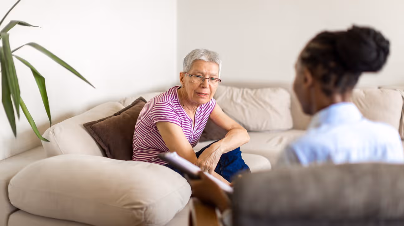 Therapist and client in a calm therapy room, illustrating a trauma-focused therapy session